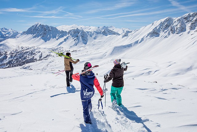 FR Vars Spring skiers, holding skis.