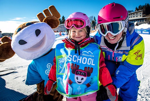 Ski instructor with student, Europe.