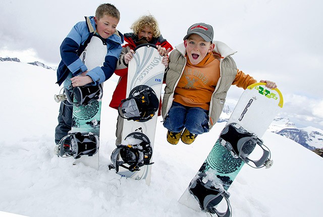 FR-boys holding snowboards Avoriaz.